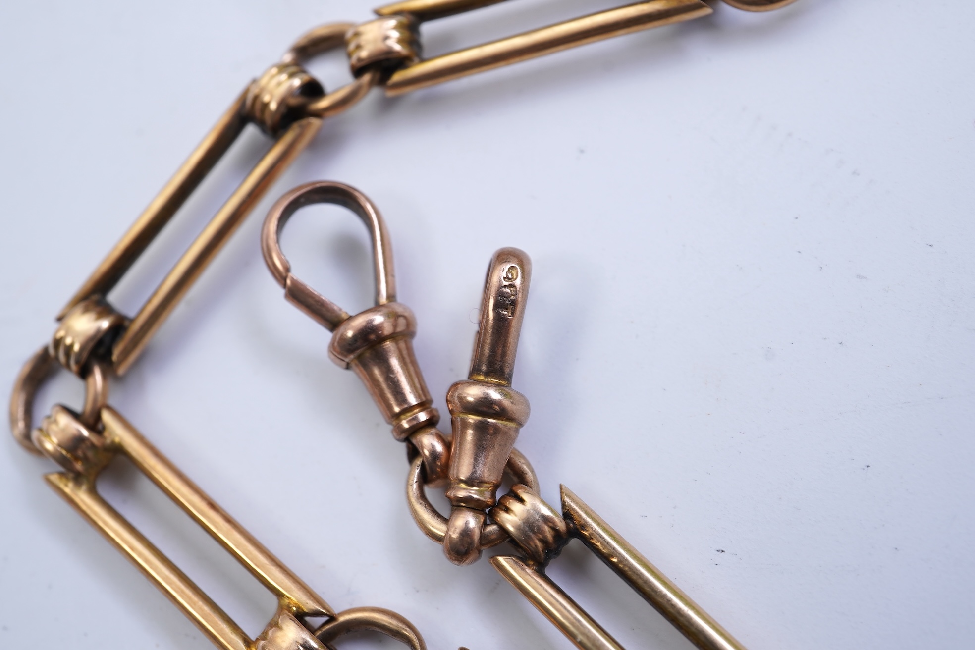 A continental 18k gold open faced keyless lever pocket watch, with a 9ct albert